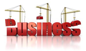 3d illustration of three cranes building text 'business', over white background