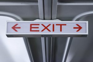 dim-exit-sign-with-arrows_medium